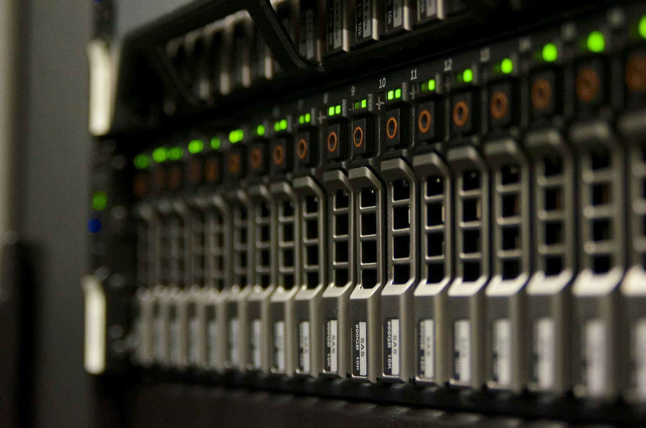 Green status lights glowing across a row of server racks